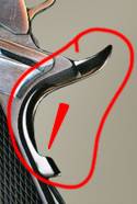 This is a beavertail grip safety. Note the sharp turn up at the back, and the small pressure point added where the arrow points. This is a beavertail grip safety. Note the sharp turn up at the back, and the small pressure point added where the arrow points.