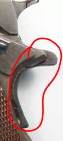 This is a standard grip safety. Note that it doesn't protrude all that far from the back of the frame. It's very easy to get the meat of your hand over this thing and get pinched by the hammer coming back when the slide cycles ("hammer bite") or be nipped by the slide as it cycles. This is a standard grip safety. Note that it doesn't protrude all that far from the back of the frame. It's very easy to get the meat of your hand over this thing and get pinched by the hammer coming back when the slide cycles ("hammer bite") or be nipped by the slide as it cycles.