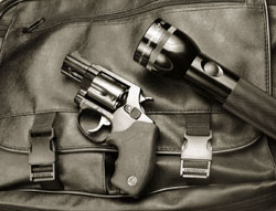 Revolver and Maglite as part of an Urban Survival Kit Revolver and Maglite as part of an Urban Survival Kit
